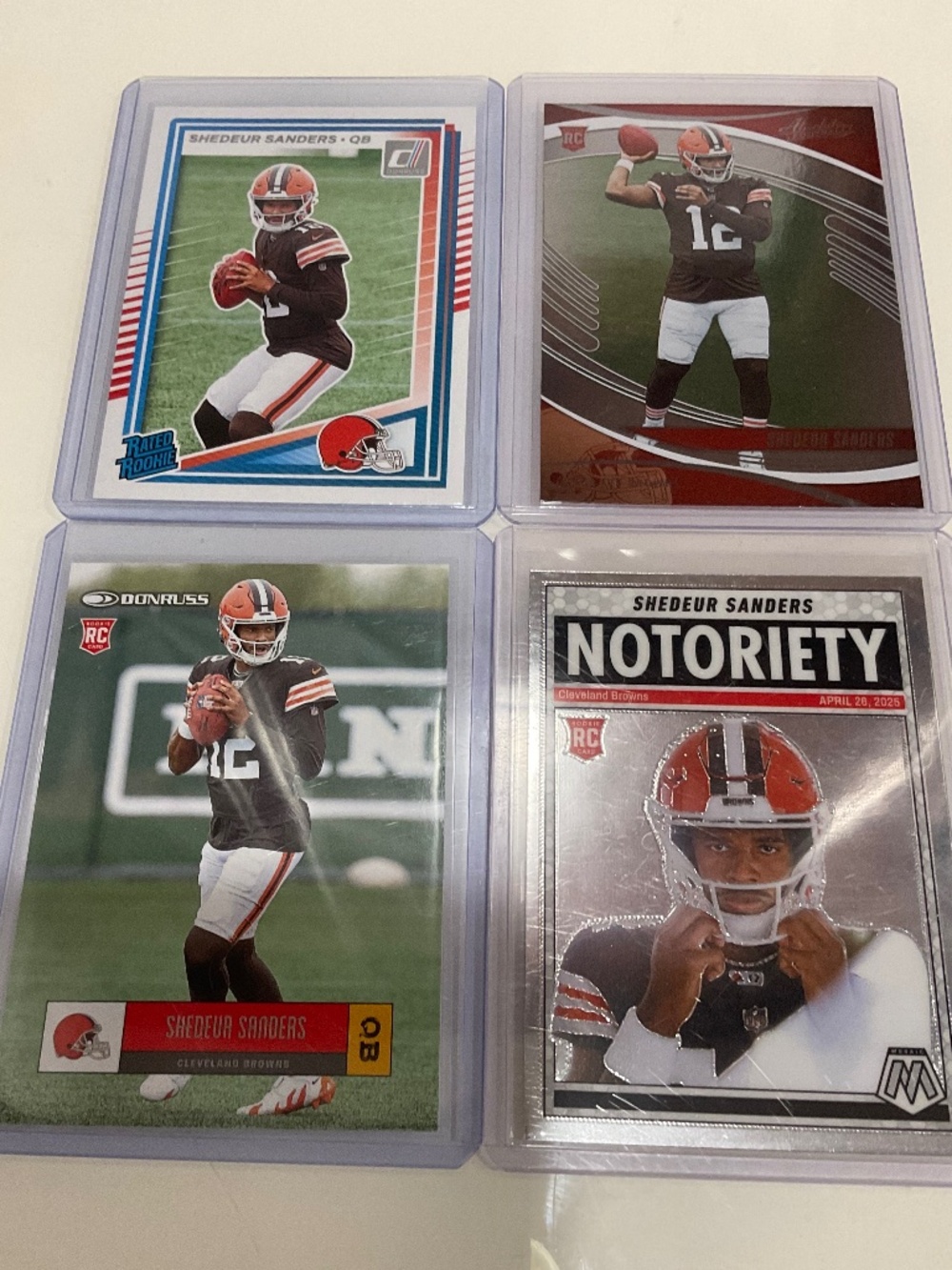 Shedeur Sanders 4 Card Rookie Lot:  Browns.  Mosaic, Donruss, Absolute
